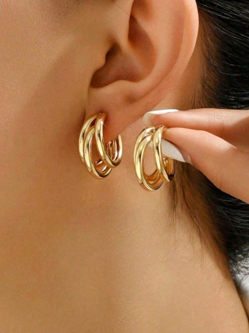 1 par de brincos de argola de aço inoxidável.