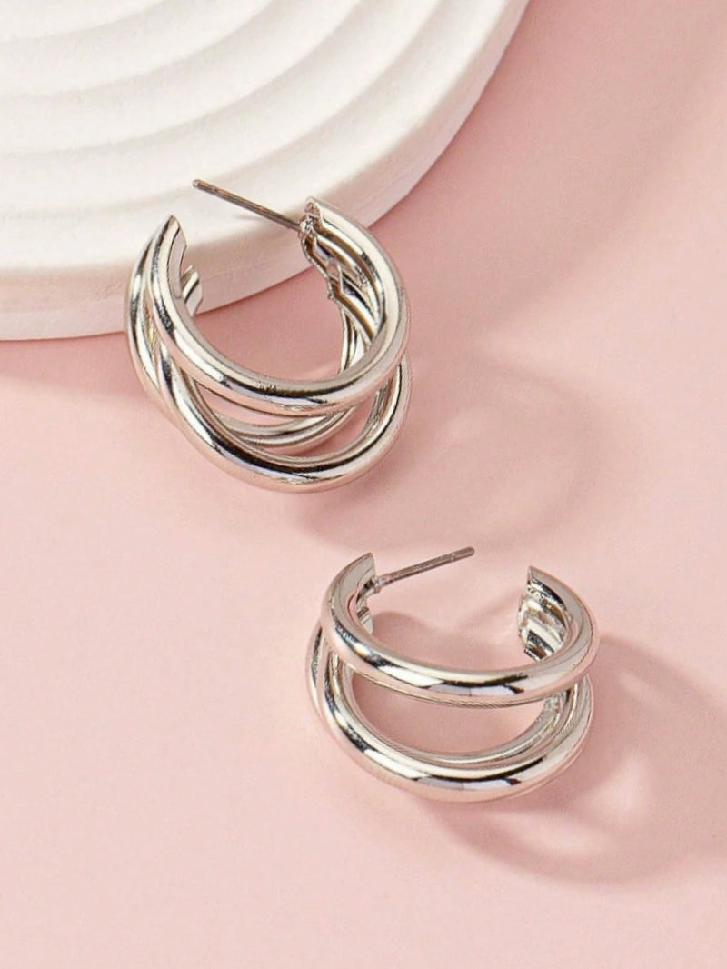 1 par de brincos de argola de aço inoxidável.